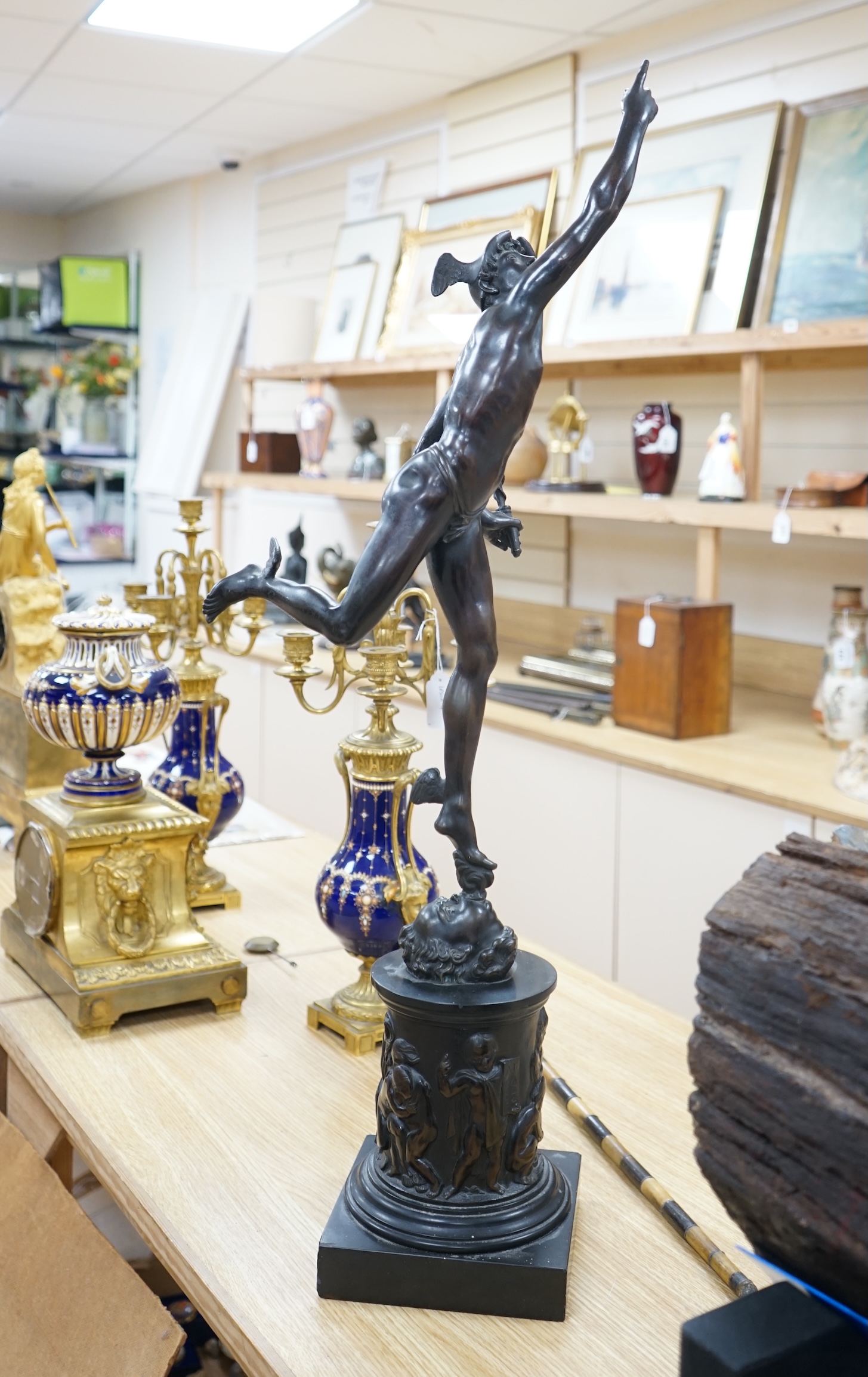 A late 19th / early 20th century Grand Tour style bronze study of Mercury raised on a circular column base, 87cm high. Condition - small chips to black slate plinth otherwise in good condition